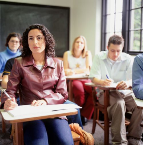 Students sitting in lesson, in classroom