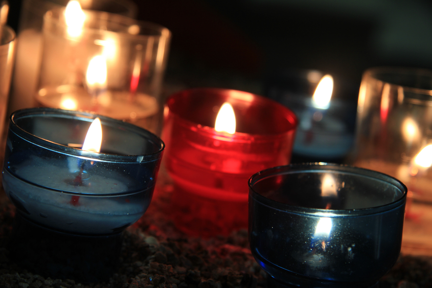 Votive candles, burning in a French Roman Catholic church